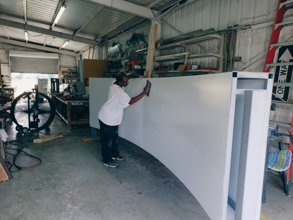 Man Sanding Down large blank sign Man Sanding Down large blank sign