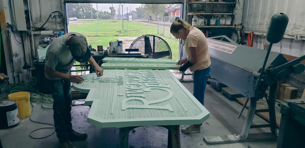 Two People Making Large Sign Two People Making Large Sign